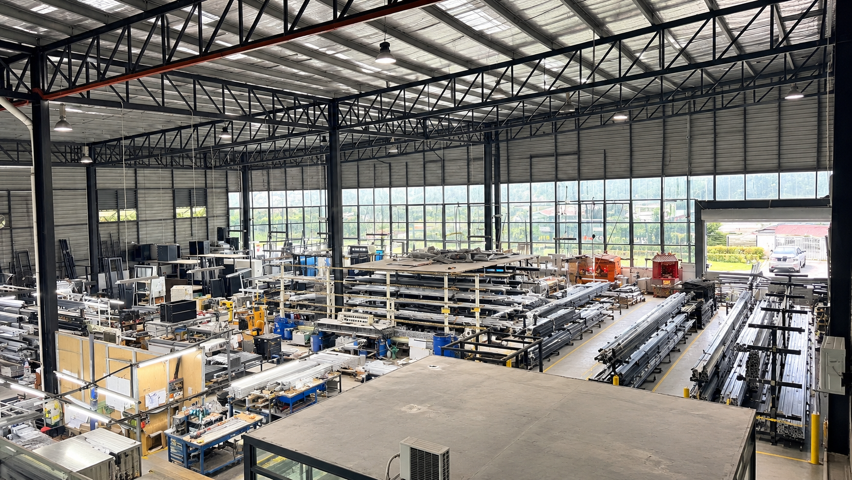 CT Aluminium aluminium fabrication facility interior in Johor Bahru with production equipment and aluminium profiles
